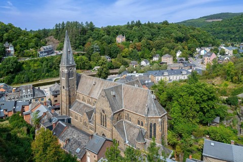 St. Nicholas Church seen from the castle ruins in the city La Roche-en-Ardenne in summer, province