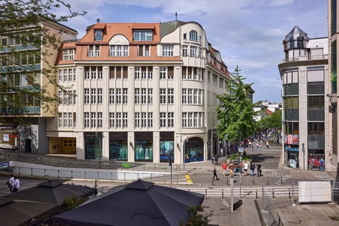 City centre, general architecture, shops, pedestrians as accessories, elevated perspective, blue