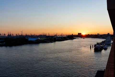 Hamburg harbour, view from the Elbphilharmonie over the Elbe at sunset, cranes of the container