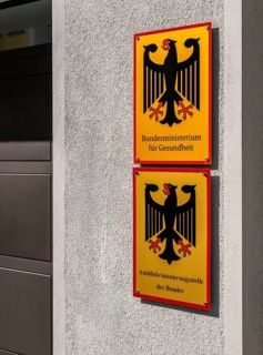 Yellow information signs, federal eagle with reference to federal ministries located there in the