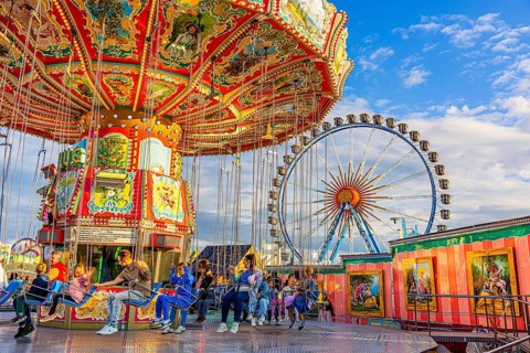 Chain carousel at a standstill, Ferris wheel in the background, Theresienwiese, Oktoberfest,