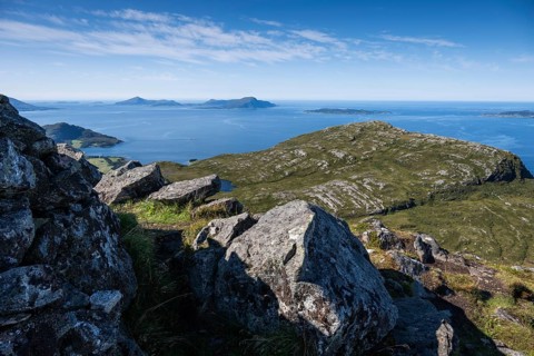 View over rocky mountain and coastal landscape, offshore islands in the background, Otroya or