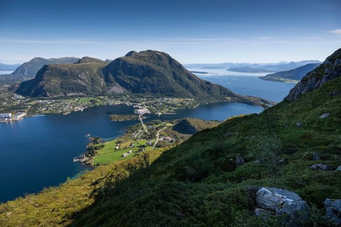 Expansive coastal view with mountains, sea and the village of Midsund, Otroya or Otrøya Island,