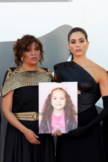 Venice, Italy - 3 September 2025: Kaouther Ben Hania and Saja Kilani with a portrait of