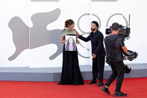 Venice, Italy - 3 September 2025: Kaouther Ben Hania with a portrait of five-year-old Palestinian