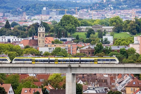 SWEG regional train travelling on the Schusterbahn, Münster viaduct with Bad Cannstatt and