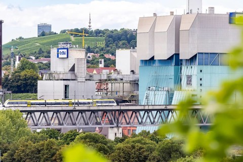 SWEG regional train travelling on the Schusterbahn, Münster viaduct with EnBW Energie