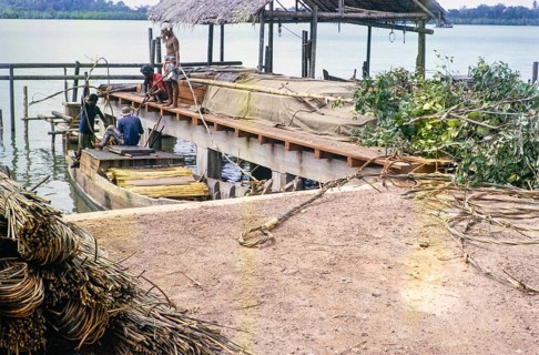 Coastal village loading boats, Singapore and Johor Bahru, Malaysia, Southeast Asia 1964