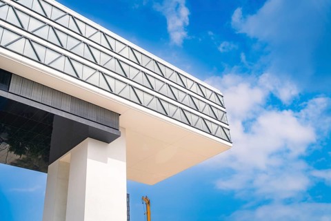 Modern building against a blue sky with geometric shapes, Medienbrücke, Munich, Germany