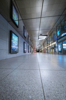 Perspective of a corridor in an empty underground station with tiled floor, Münchner Freiheit,