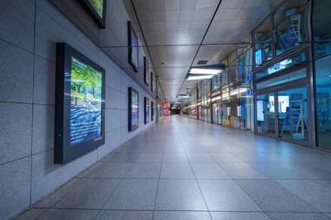 Empty corridor of a modern underground station with tiles and lighting, Münchner Freiheit, Munich,