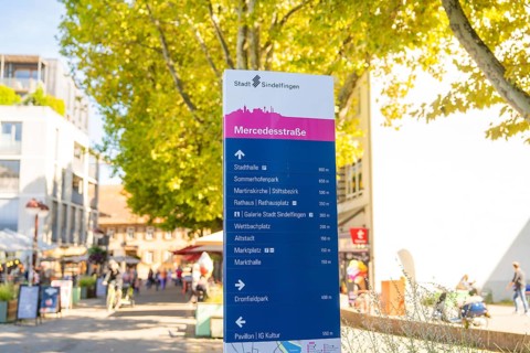 Signposts in an urban environment, destinations and distances, sunny and lively, Sindelfingen,