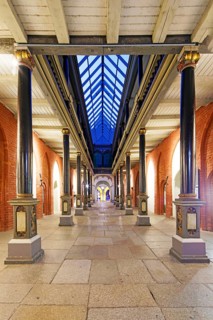 Night view, north-south passageway with columns and arcade gallery, two storeys, town hall