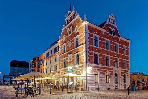 Night shot, magnificent building with outdoor seating and sunshade, built in 1889, Hiddenseer