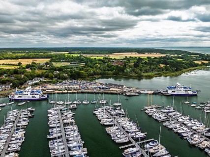 Wight Light car ferry to Isle of Wight on Lymington River and marina from drone, Lymington, New