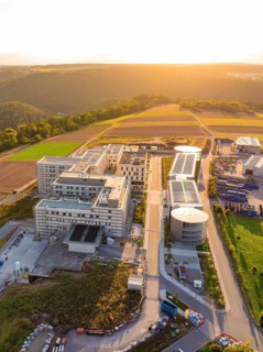 Compact aerial view of a modern building complex at sunset, new hospital building, Calw health