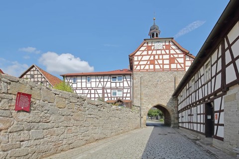 Historic Lower Tor with spire and clock and half-timbered houses, Tor tor, town gate, town wall,