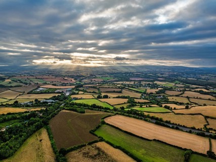 Sunset of Fields and Farms over Devon from drone, Torquay, Torbay, Devon, England, United Kingdom