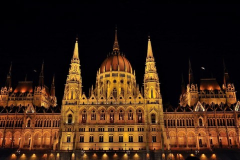 Majestic hungarian parliament building glowing at night, showcasing its stunning architecture and