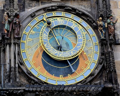 Close up of the historical astronomical clock, featuring intricate details, zodiac signs, and time