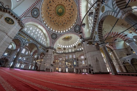 Wide angle view of the suleymaniye mosque interior in istanbul, turkey, showing the vastness of the
