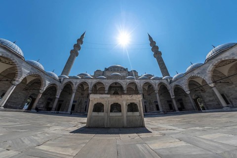Wide angle view of the courtyard of suleymaniye mosque in istanbul, turkey, featuring intricate