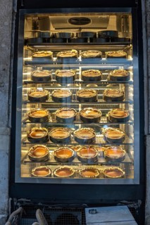 Rows of traditional turkish cheesecakes, called san sebastian cheesecakes, are displayed in a