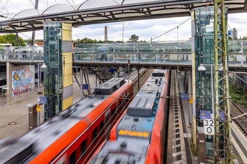 Railway station with passing S-Bahn in Walldorf-Wiesloch. Wiesloch, Baden-Württemberg, Germany