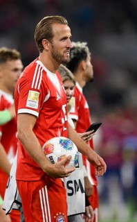Harry Kane FC Bayern Munich FCB (09) satisfied with match ball after the end of the game Allianz