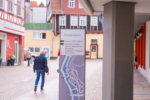 Detailed architecture with half-timbered houses and a walking man, small town of Perle Calw, Black