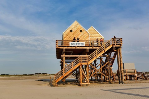Pile dwelling, toilet house on the beach, walker, Sankt Peter-Ording, Eiderstedt peninsula, Wadden