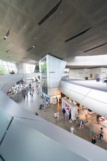 Modern building complex with various shops and numerous visitors, BMW Welt, Munich, Germany