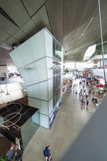 View from above of an exhibition space with many visitors and modern elements, BMW Welt, Munich,