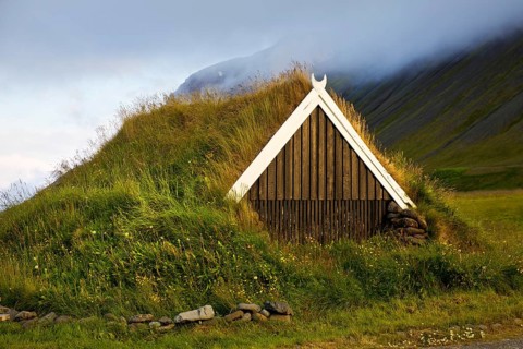 Traditional wooden hut with sod roof, Reykjadiskur, Iceland