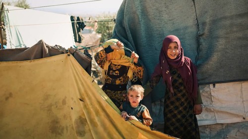 Syrian children playing in a refugee camp near the Turkish border on World Children's Day. Aleppo,