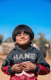Syrian children playing in a refugee camp near the Turkish border on World Children's Day. Aleppo,