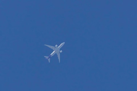 Airbus A300-600RF jet aircraft of FedEx Express airlines in flight in a blue sky, England, United