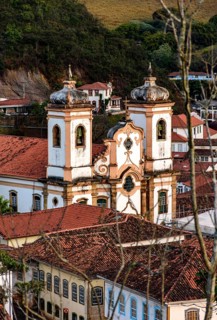 Church between the roofs of the colonial houses in the city of Ouro Preto in Minas Gerais, Ouro