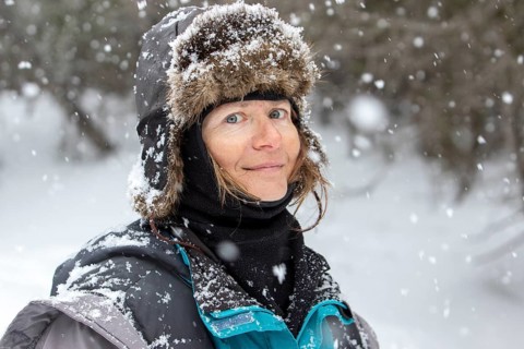 Woman enjoying a cold weather, Woman smiling under a snowfall, Gaspesie national park, Province of