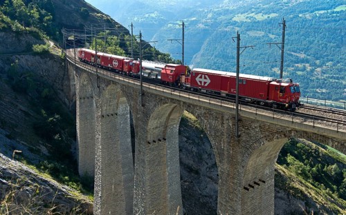 Goods train of the Swiss railway company SBB crosses the Luogelkin Viaduct on the Lötschberg south