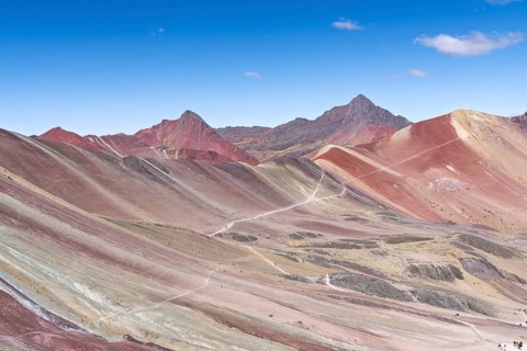 Vinicunca, colourful mountains in the background, in the Peruvian Andes, Cusipata district, Cusco,