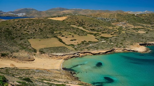 Bay of Vai, coastal landscape with turquoise water and overgrown hills under a clear sky, Analipsi,
