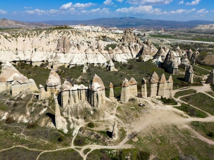 Striking rock needles line the wide valley in the Cappadocia region, aerial view, Love Valley,
