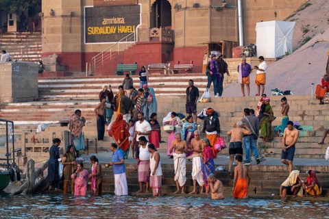 Hindu devotees take a dip in the Ganges, at Hanuman Ghat, Mughalsarai, Uttar Pradesh, India