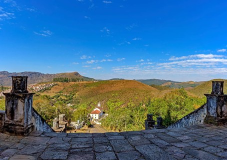 Old stone buildings and a church on the hills of the city of Ouro Preto in Minas Gerais, Ouro