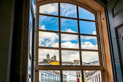 City of Ouro Preto seen through the window of an old colonial-style house, Ouro Preto, Minas