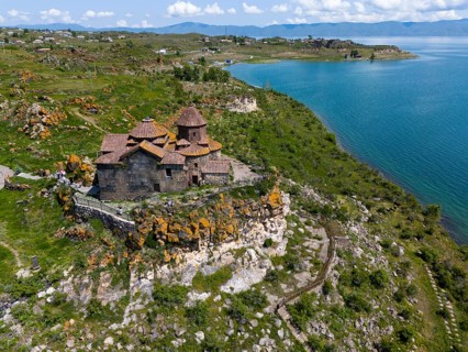 Church perched above a magnificent lake with a panoramic view of the surrounding countryside,