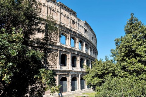 Partially restored façade of the exterior façade of the Roman Colosseum from antiquity, west side,