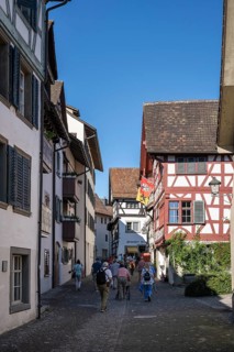 Old town alley with historic half-timbered houses with tourists, Stein am Rhein, Canton
