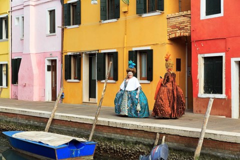 Two dressed up woman, Venetian costumes with masks, colourful facades, Burano, Venice, Veneto,